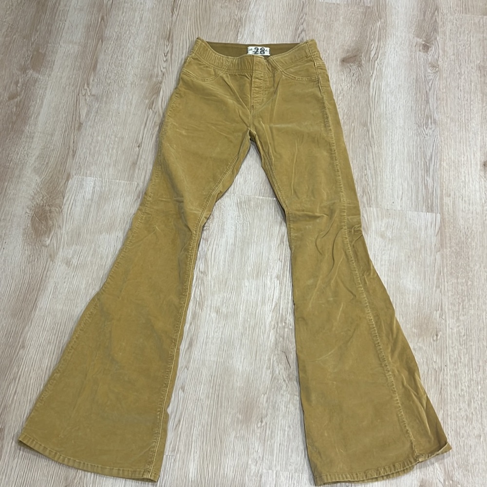 Free people flare leg stretch pull on corduroy pants size 28 in yellow gold.